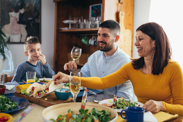 family gathering at home. vegan dinner party