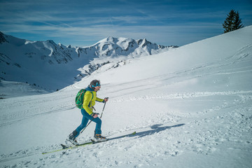 Fototapeta na wymiar Austria, Allgäu, Kleinwalsertal, ski tourer at the Schwarzwassertal