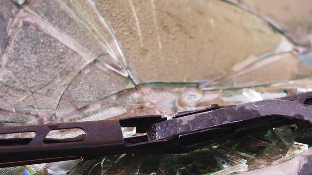 shattered windshield after car accident slow motion detail shot