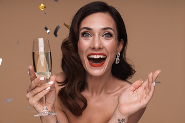 Beauty portrait of excited adult half-naked woman holding champagne glass © Drobot Dean