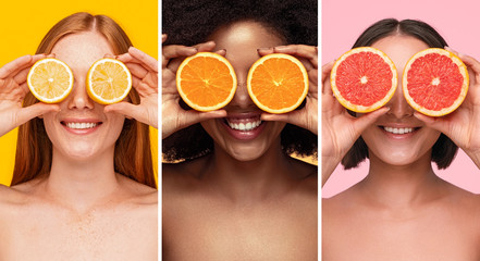 Multiracial women covering eyes with slices of citrus fruits