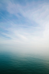 Scenic view of sky and sea blending into a misty white horizon