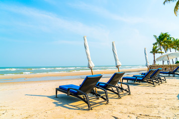 beach chair on beach with sea and blue sky background