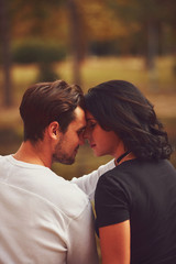 Obraz premium Couple in love hugging and kissing outdoors. Love concept.