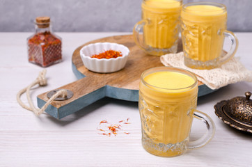 Yellow smoothie in glass