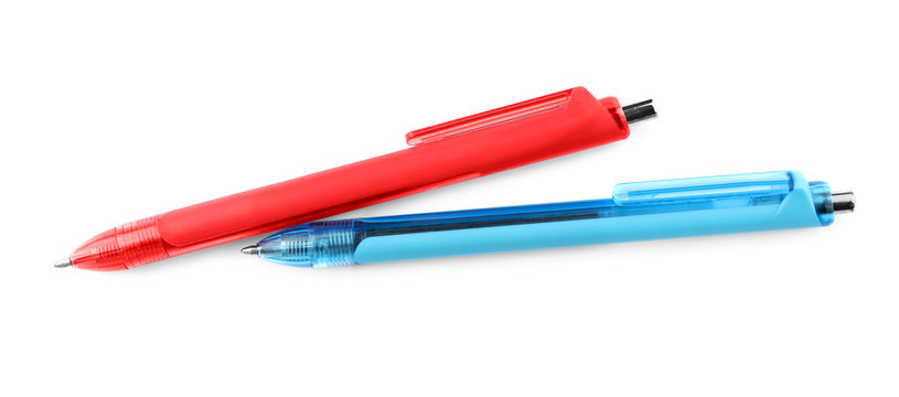 Red and blue retractable pens isolated on white, top view