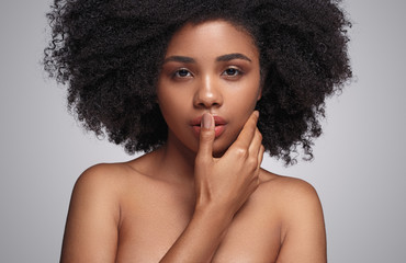 African American woman touching face