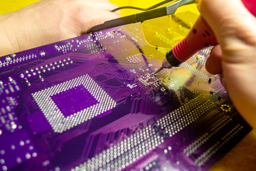 The master is trying to fix the motherboard Blurred background