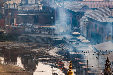 Pashupatinath complex, cremation of the dead on the banks of the sacred Bagmati river, partially destroyed during the earthquake 2015. Kathmandu, Nepal