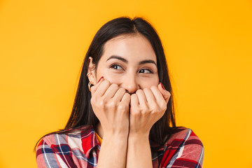 Image of happy woman expressing surprise and covering her mouth