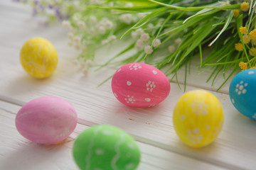 Easter eggs on a white wooden surface