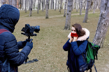 Photographer and woman in late wither forest