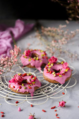 Fototapeta na wymiar Vegan raw raspberry glaze donuts.selective focus.