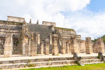 Fototapeta na wymiar The Temple of the Warriors (Templo de los Guerreros) complex. Chichen Itza archaeological site. Architecture of ancient maya civilization. Travel photo or wallpaper. Yucatan. Mexico.