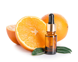 Bottle of orange essential oil on white background