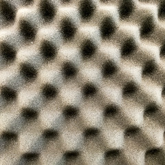 Selective focus images of Polyurethane foam soundproof panel pattern with the black grey...