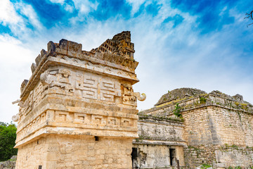 Fototapeta premium A small temple (La Iglesia) decorated with elaborate masks. Chichen Itza archaeological site. Architecture of ancient maya civilization. Travel photo or wallpaper. Yucatan. Mexico.