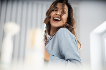 Smiling lady having fun time at home