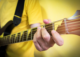 yellow concept : man playing guitar.