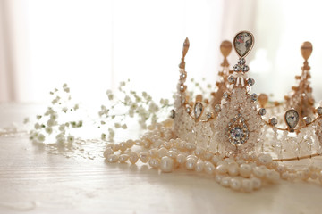 Vintage crown and pearls necklace. Wedding concept. Back light