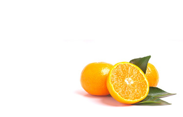 Fresh orange and leaves isolated on white background.