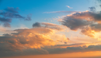 Naklejka na ściany i meble Beautiful bright sunset sky with clouds. Nature sky background. 