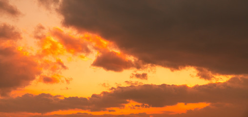 Beautiful bright sunset sky with clouds. Nature sky background. 