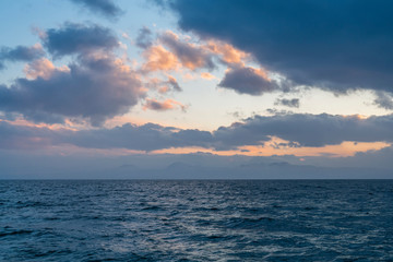 Beautiful landscape. Bright colorful sunset with dramatics clouds over the lake. 