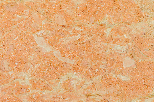 Quality orange marble texture, macro shot. Good texture details. Blank marble surface.