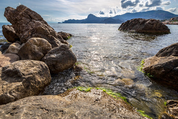 Fototapeta na wymiar Beautiful summer sea landscape at the resort in the Crimea. Rocky coast of the black sea. Seascape.