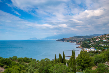 Fototapeta na wymiar Beautiful summer sea landscape at the resort in the Crimea. Rocky coast of the black sea. Seascape.