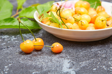 Fresh yellow cherries on the table