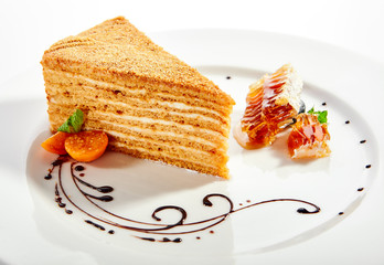 Medovik slice in white plate