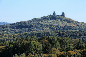 Fototapeta na wymiar Distant towers to Trosky castle ruins on the top of hill