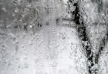Gray background. Window with raindrops.