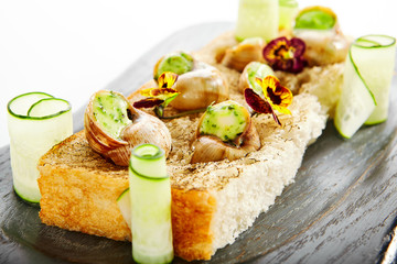 Snails with garlic and cheese side view