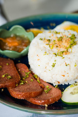 processed meat with garlic rice and fried egg on the side