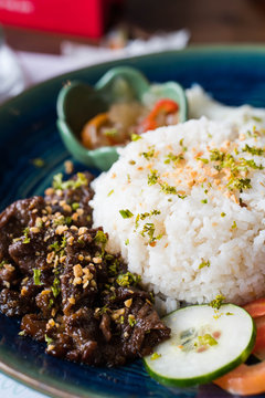 beef tapa with garlic rice and egg on the side