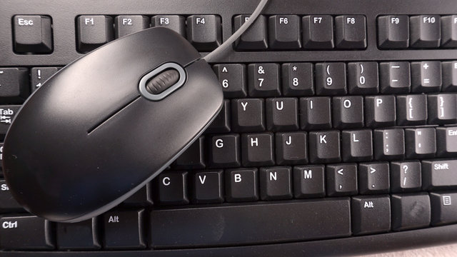 A computer keyboard and electronic mouse isolated.