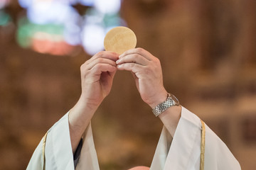 Priest giving Eucharist