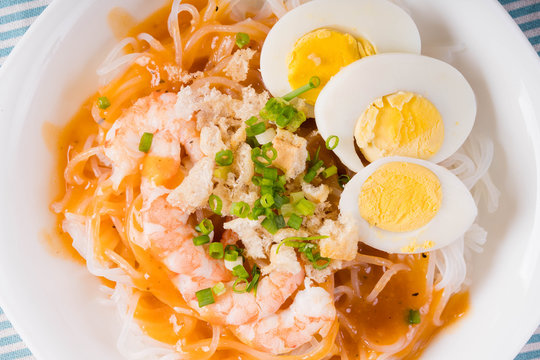 thick rice noodles with shrimp sauce, crispy pork skin and boiled egg also known as palabok