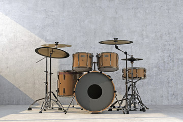 Fototapeta na wymiar bronze drum kit on concrete wall background