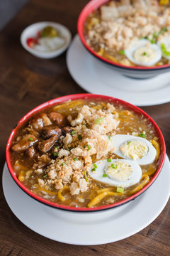 beef brisket in thick egg noodle soup or also known as beef pares lomi