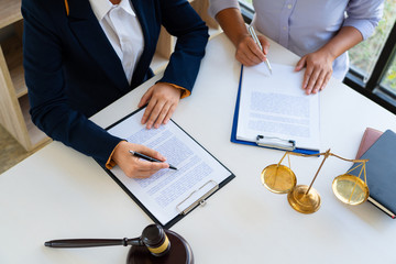 Female Lawyer explaining legal situation and discussing with contract papers, Concepts of law,...