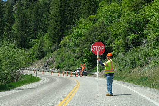 Flagger with a stop sign on an American road 