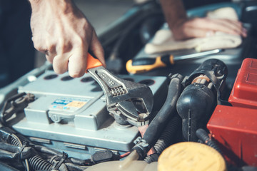 man to repair car
