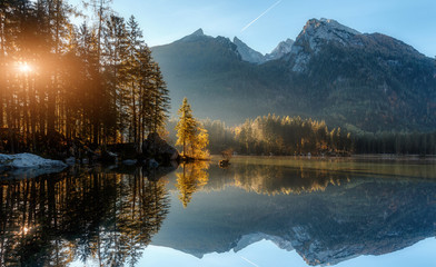 Awesome alpine lake during sunset. Scenic image of fairy-tale Landscape in sunlit with Majestic...