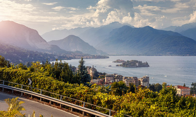 Wonderful nature landscape. Cityscape of Stresa town. Maggiore lake with Mottarone mountain on...