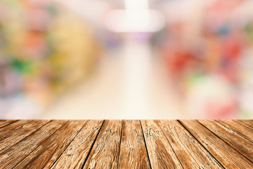 Empty Desk - Table made of Wooden Planks with Blurred Food Store - Discount Grocery Shop on Background