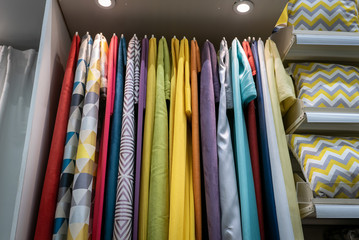 Curtains of different colors and styles in the shop